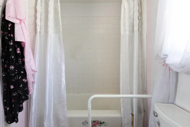 a house view with swimming pool in front of it