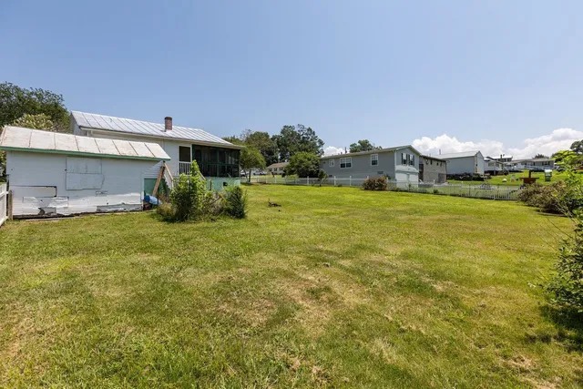 an aerial view of houses with yard