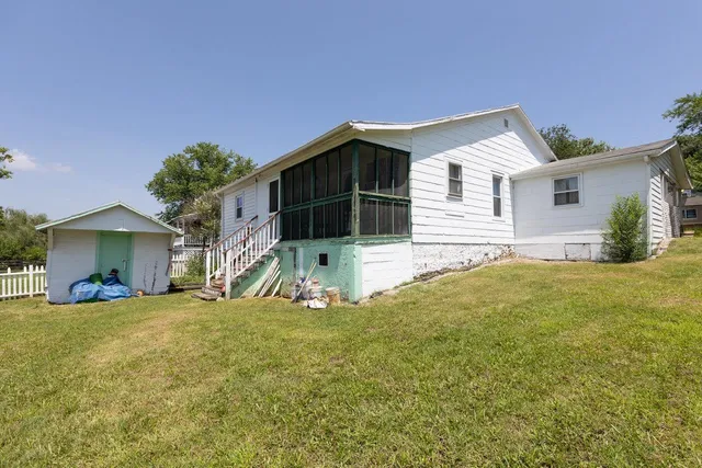 an aerial view of residential houses and outdoor space
