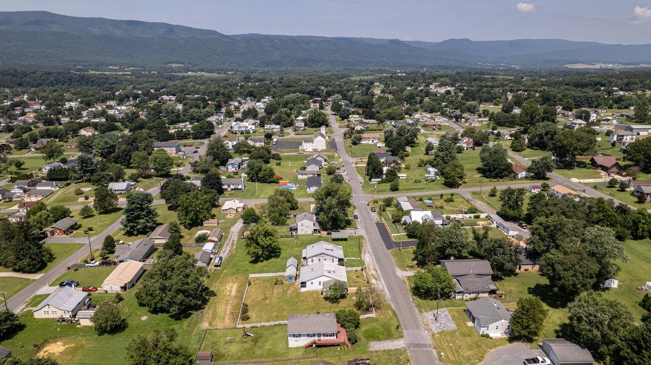 711 8th Street Shenandoah, VA 22849 - Photo 52 of 60 an aerial view of a city with lots of residential buildings and mountain view in back