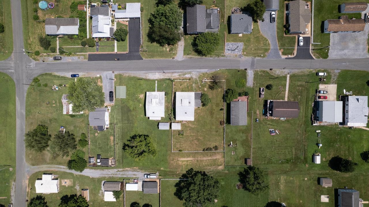 711 8th Street Shenandoah, VA 22849 - Photo 58 of 60 an aerial view of a residential apartment building with a yard