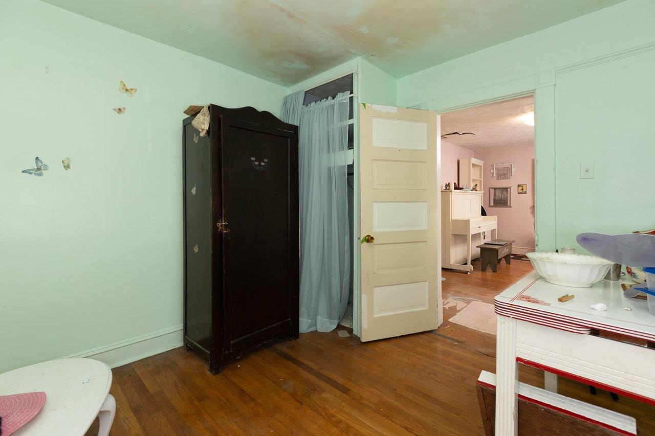711 8th Street Shenandoah, VA 22849 - Photo 7 of 60 a bedroom with a bed and wooden floor