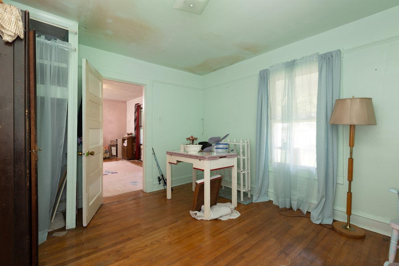 711 8th Street Shenandoah, VA 22849 - Photo 8 of 60 a view of a room with wooden floor table and chairs