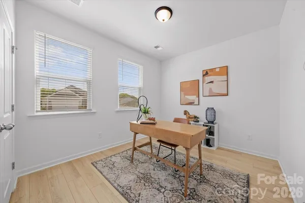 a workspace with furniture and window