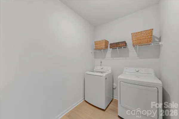 a utility room with a sink a washer and dryer