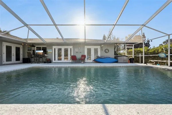 a view of pool with outdoor seating