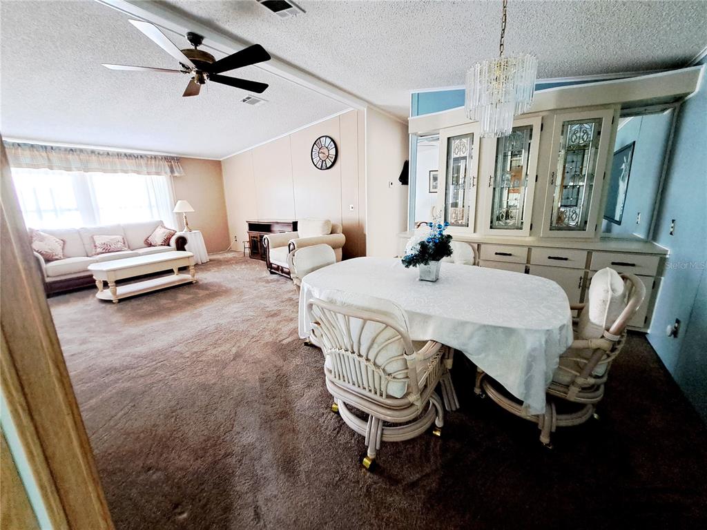 116 Maple Leaf Drive Palm Harbor, FL 34684 - Photo 12 of 38 a view of a dining room with furniture
