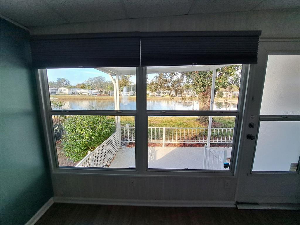 116 Maple Leaf Drive Palm Harbor, FL 34684 - Photo 24 of 38 a view of a floor to ceiling window and an outdoor view