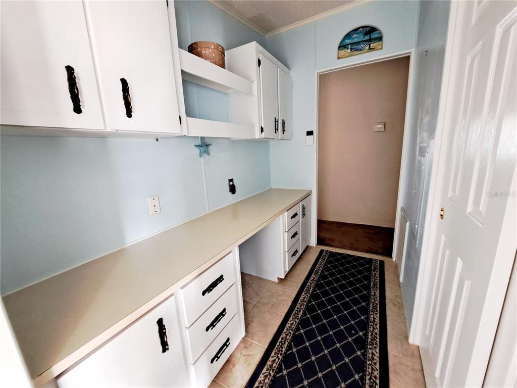 116 Maple Leaf Drive Palm Harbor, FL 34684 - Photo 26 of 38 a kitchen with sink and cabinets