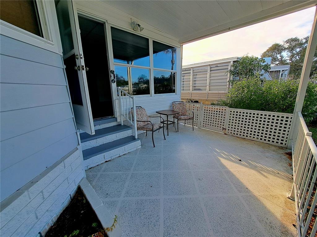 116 Maple Leaf Drive Palm Harbor, FL 34684 - Photo 4 of 38 a view of a balcony with chair