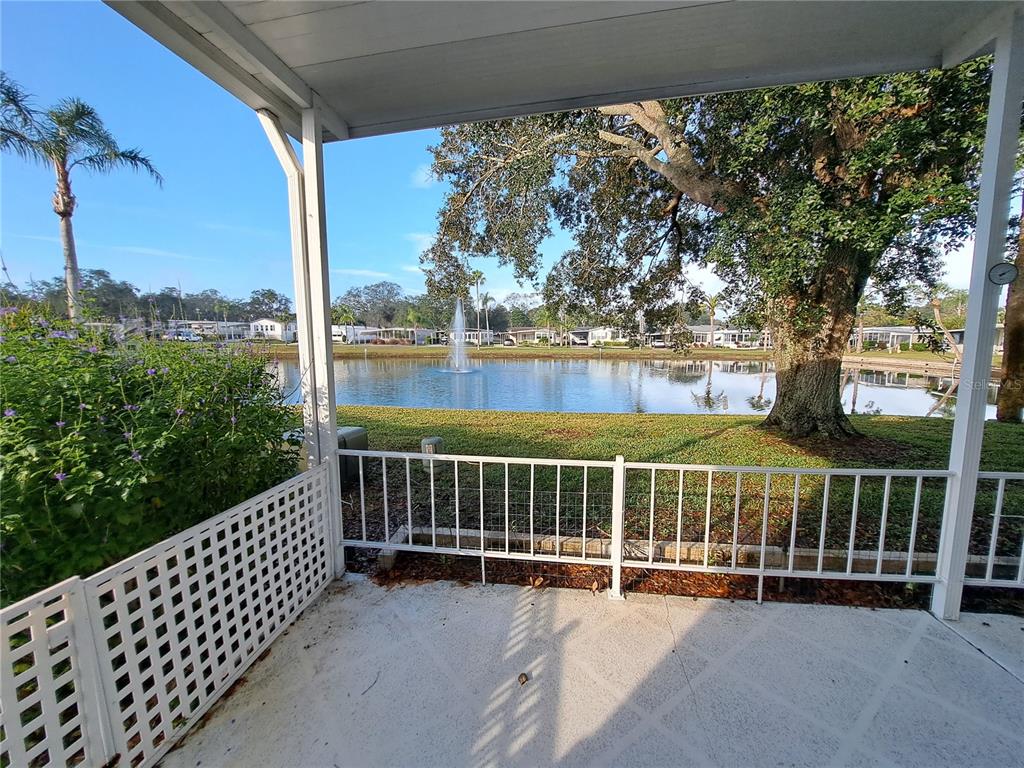 116 Maple Leaf Drive Palm Harbor, FL 34684 - Photo 5 of 38 a view of a roof deck with wooden fence and wooden floor