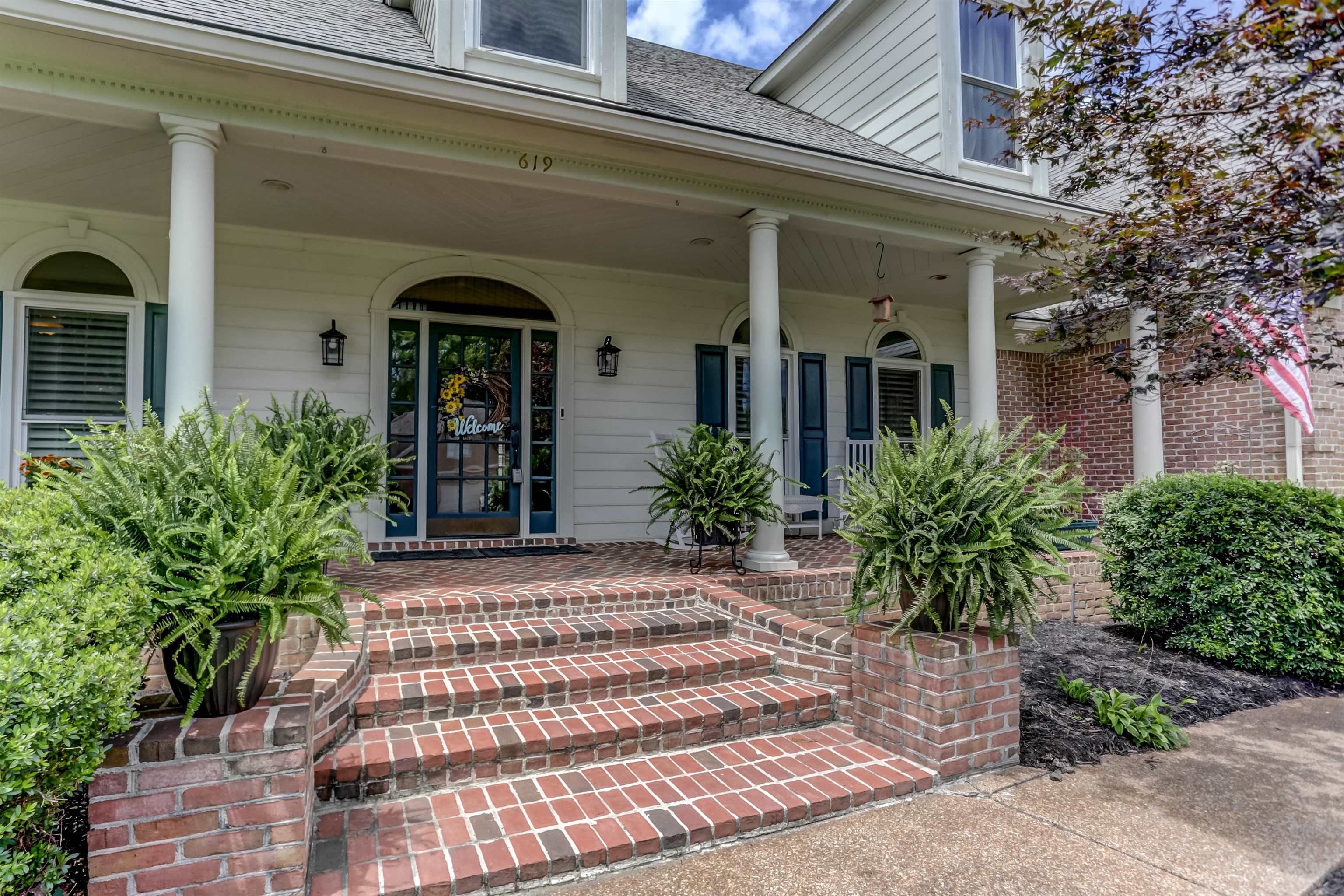 619 Roxburgh Drive Collierville, TN 38017 - Photo 3 of 30 The inviting front porch features a Herringbone brick floor.