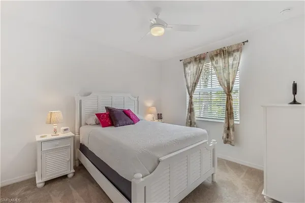 a room with a bed and window