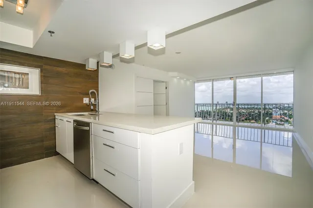 a kitchen that has a sink and a stove