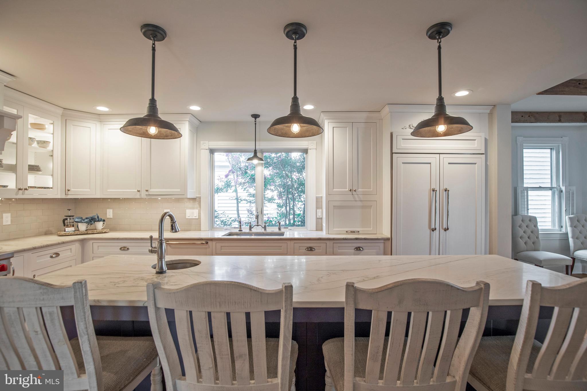 193 Decatur Street Doylestown, PA 18901 - Photo 19 of 60 a kitchen with kitchen island a dining table chairs and a window
