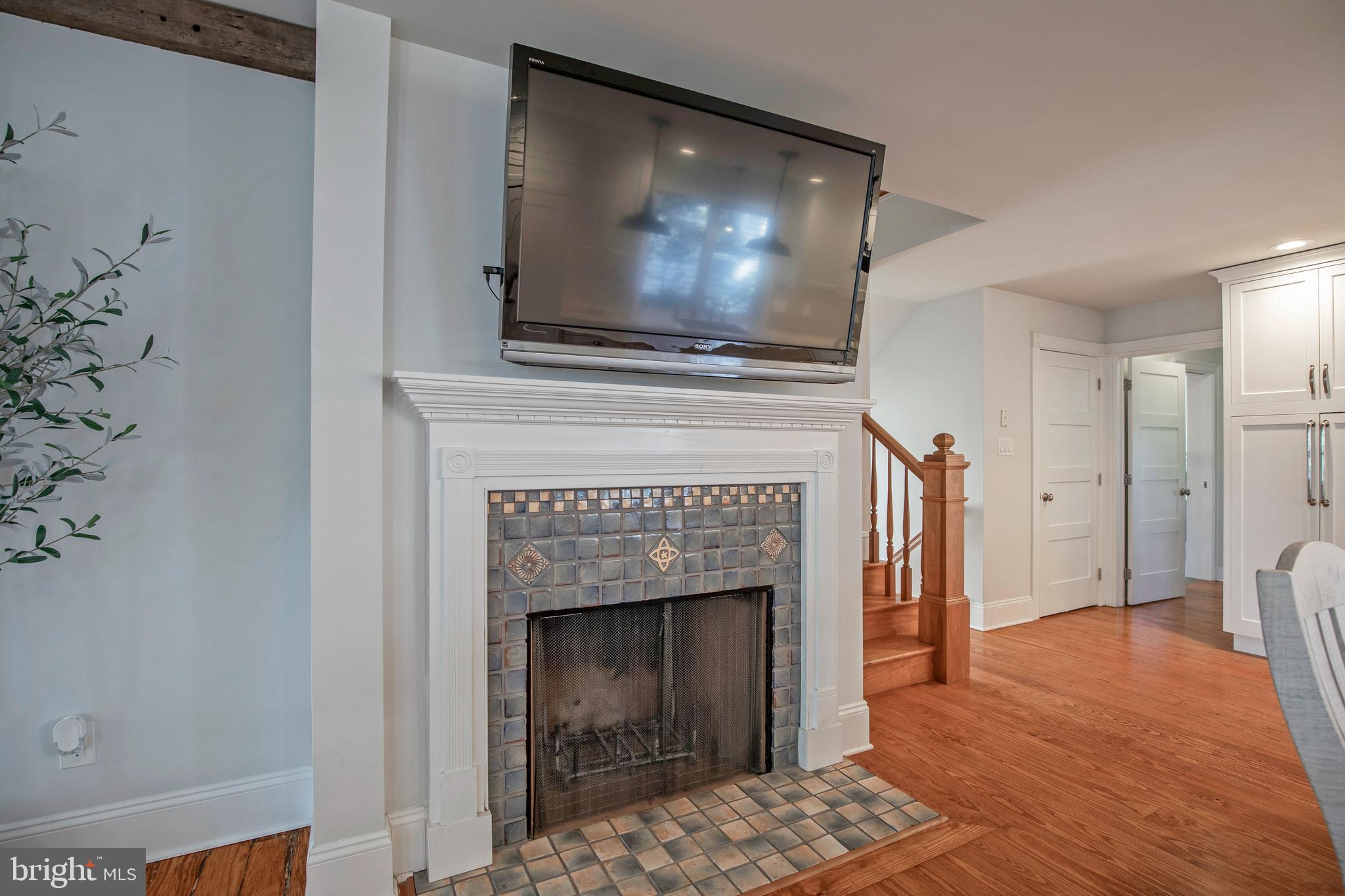 193 Decatur Street Doylestown, PA 18901 - Photo 22 of 60 a living room with a fireplace and a flat screen tv
