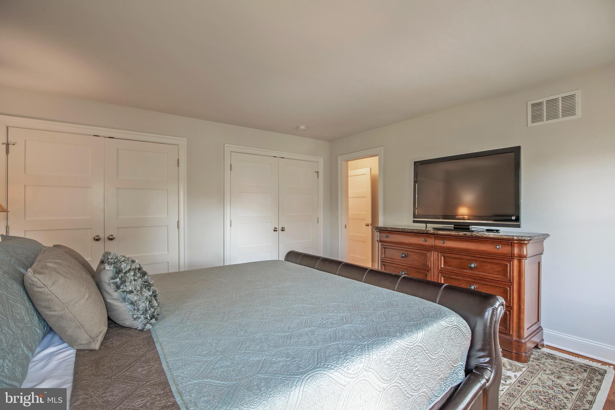193 Decatur Street Doylestown, PA 18901 - Photo 26 of 60 a bedroom with a bed and a flat screen tv