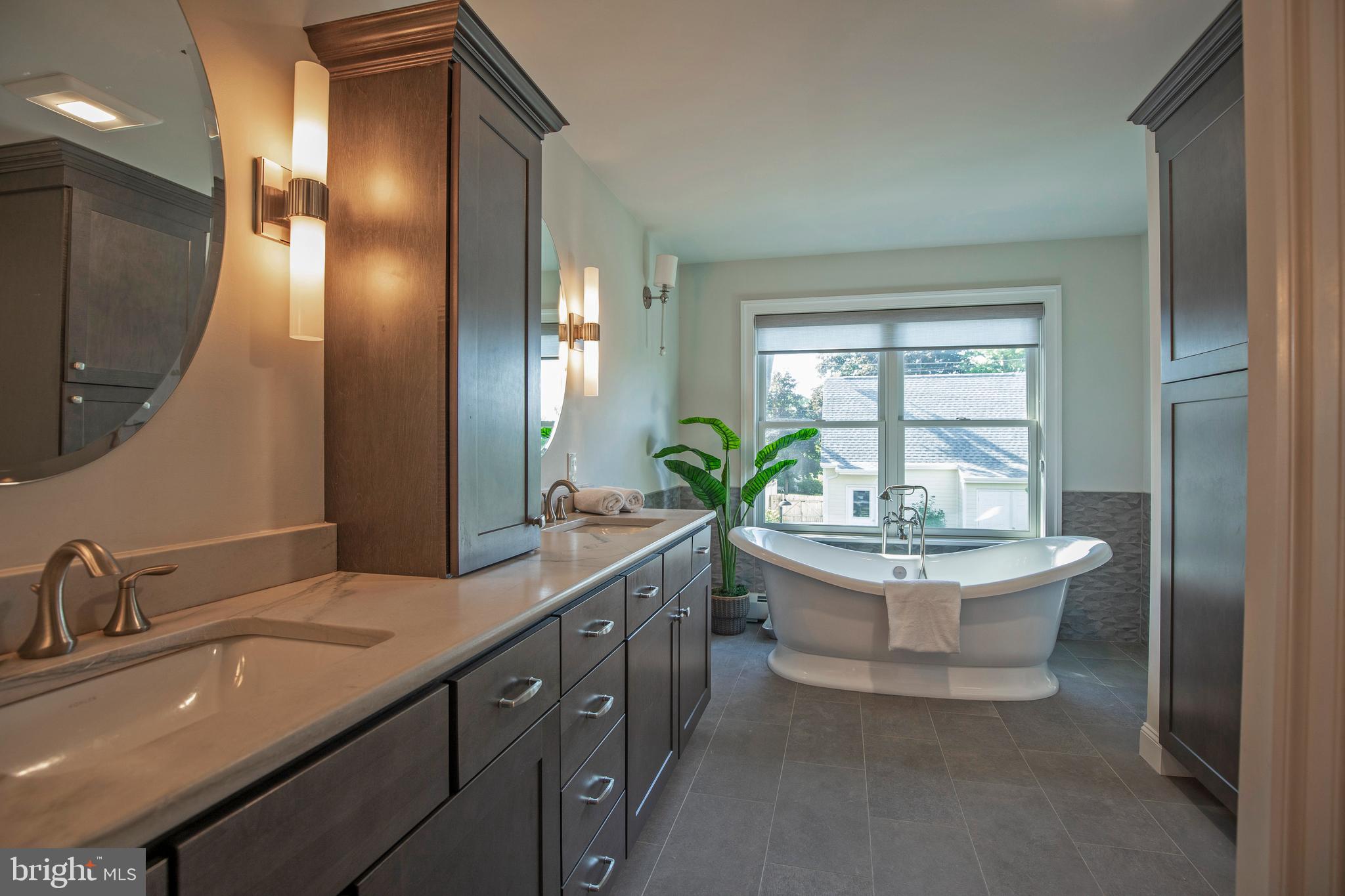 193 Decatur Street Doylestown, PA 18901 - Photo 30 of 60 a bathroom with a sink double vanity mirror and a bathtub