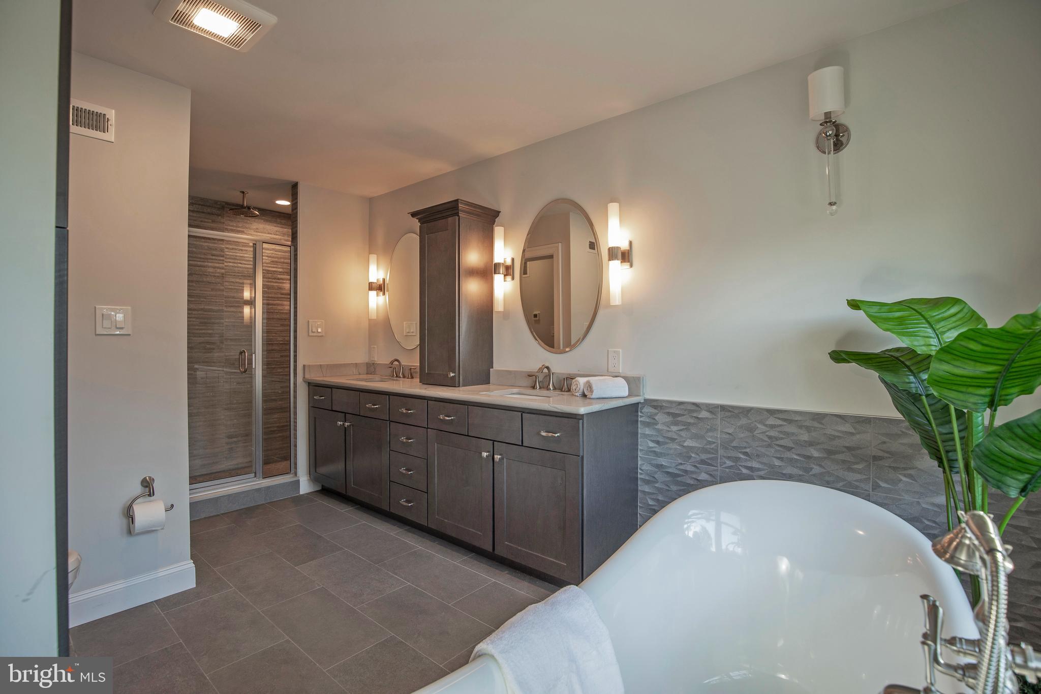 193 Decatur Street Doylestown, PA 18901 - Photo 32 of 60 a spacious bathroom with a double vanity sink and a mirror