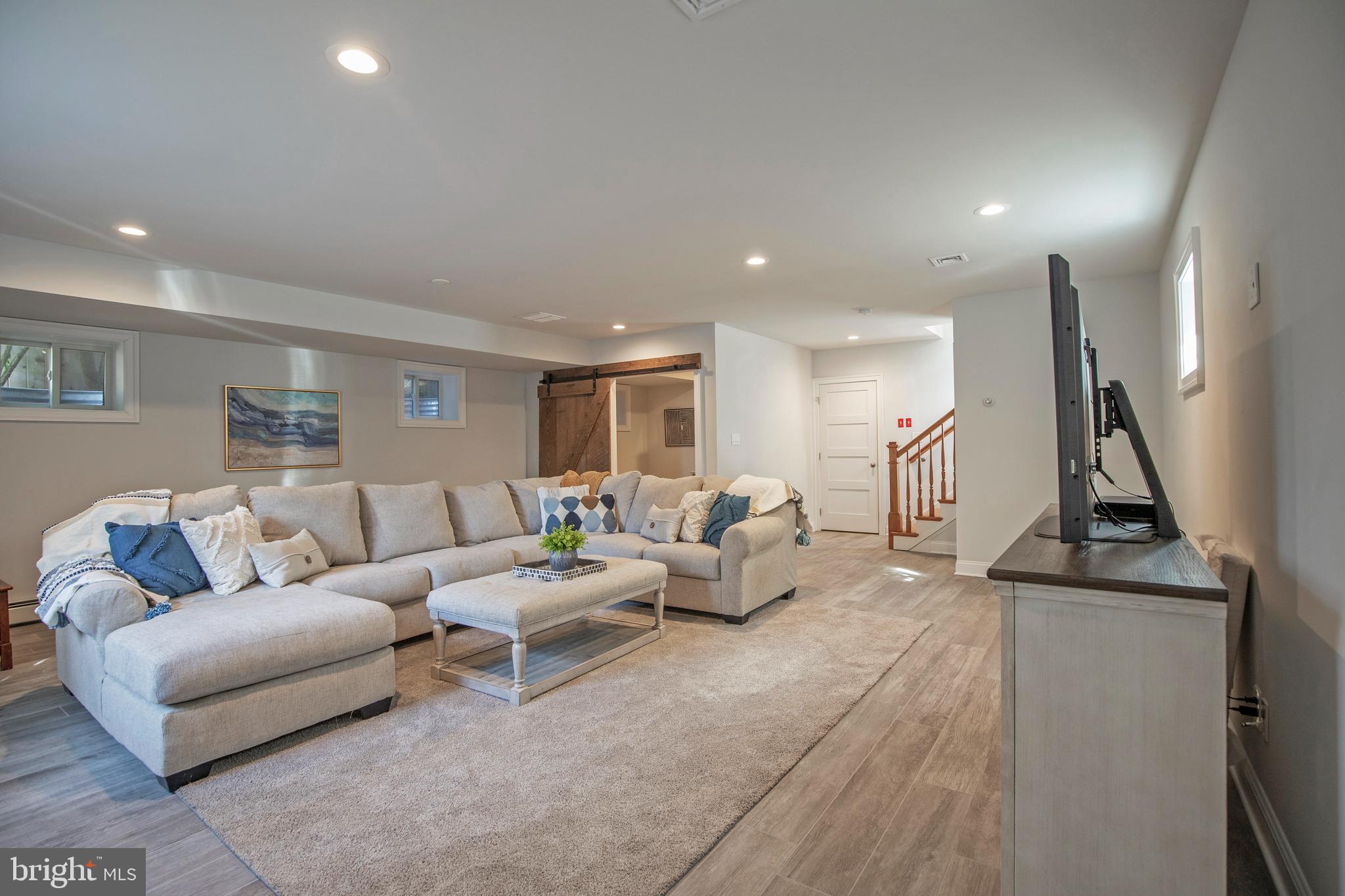 193 Decatur Street Doylestown, PA 18901 - Photo 36 of 60 a living room with furniture and a flat screen tv