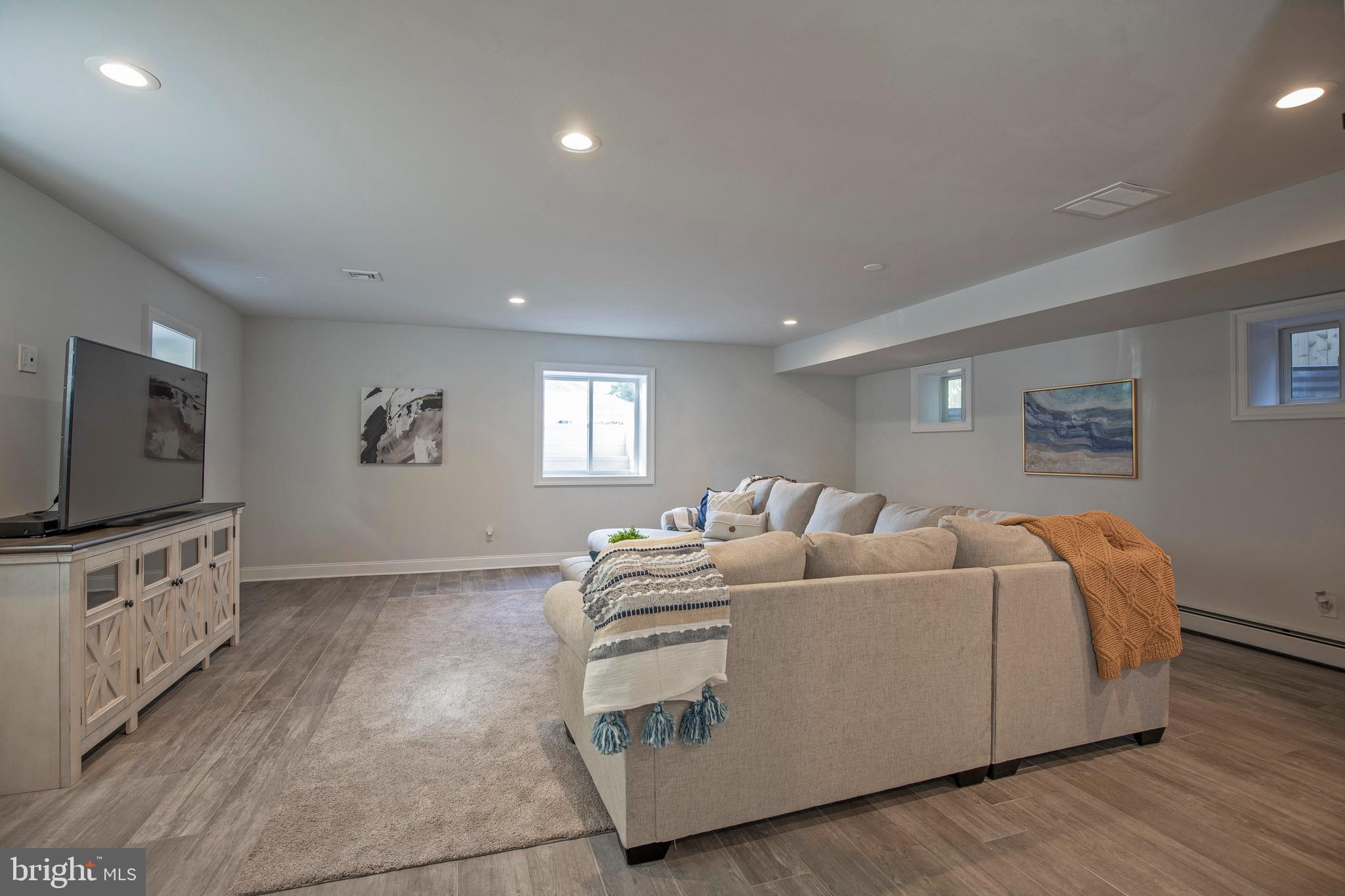 193 Decatur Street Doylestown, PA 18901 - Photo 37 of 60 a living room with furniture and a flat screen tv