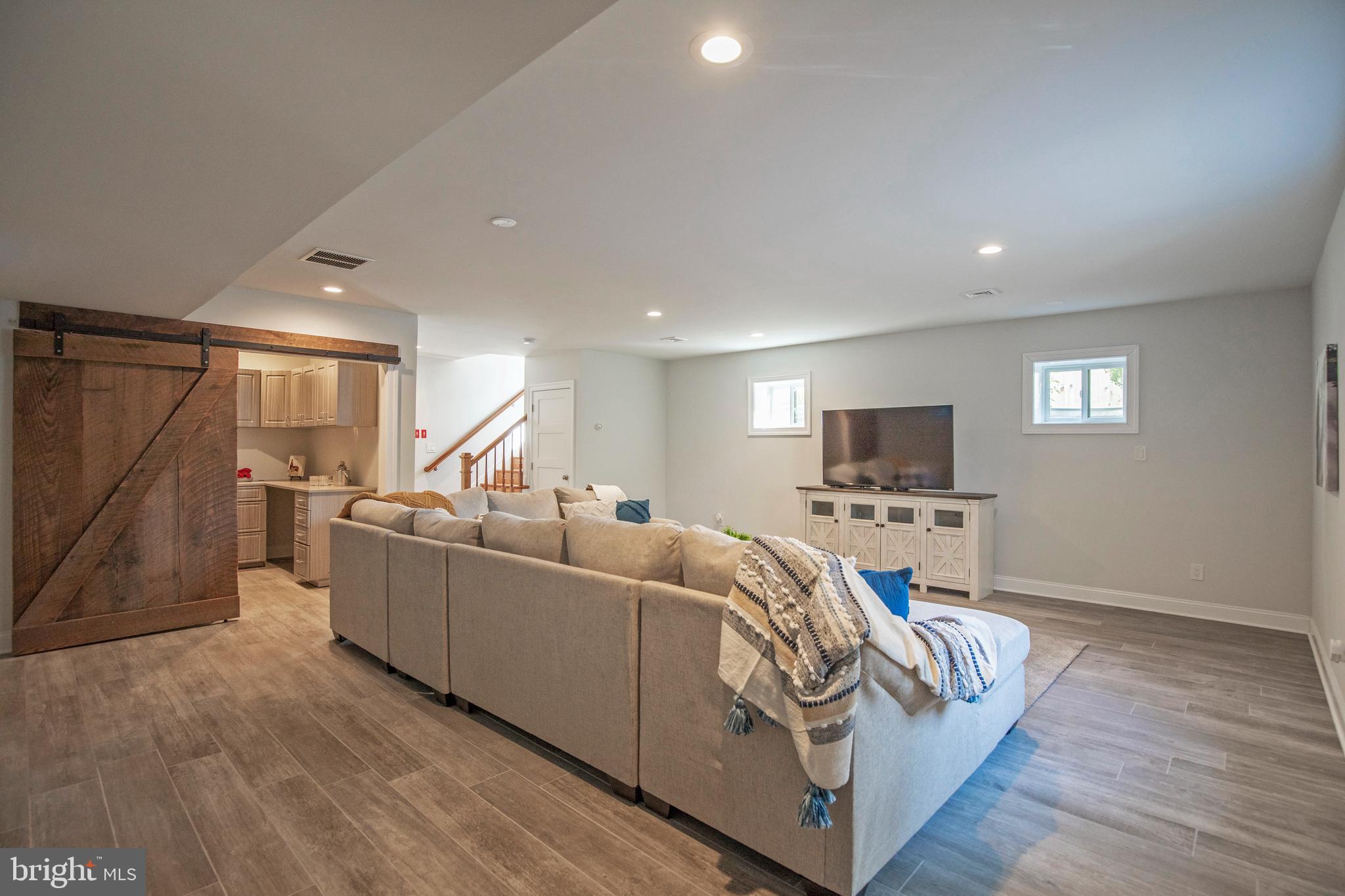 193 Decatur Street Doylestown, PA 18901 - Photo 38 of 60 a living room with furniture and a flat screen tv