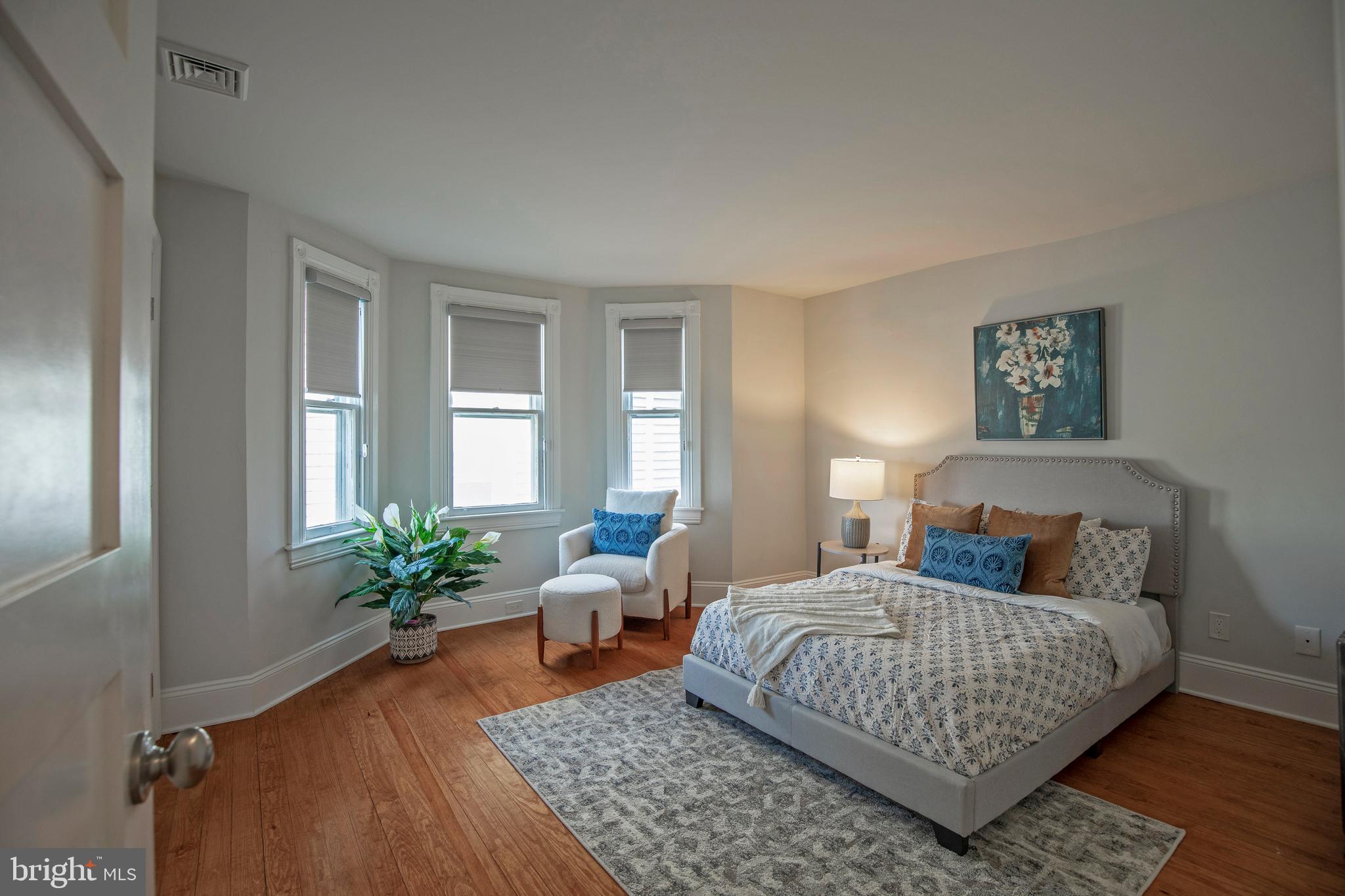 193 Decatur Street Doylestown, PA 18901 - Photo 41 of 60 a bedroom with a large bed and a potted plant