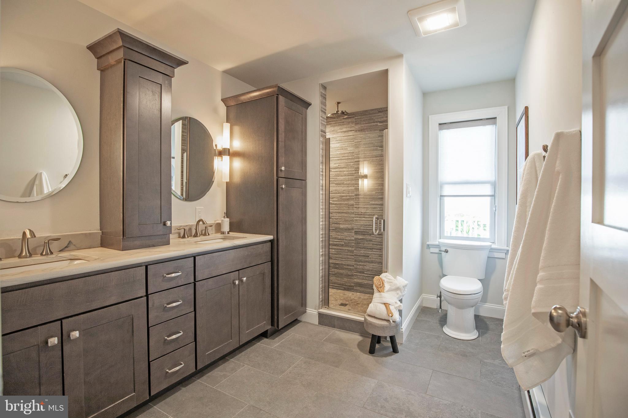 193 Decatur Street Doylestown, PA 18901 - Photo 46 of 60 a spacious bathroom with a double vanity sink a toilet and a mirror