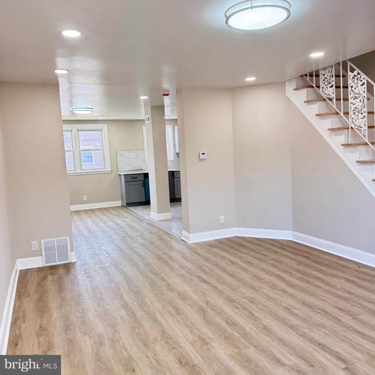 7219 Large Street Philadelphia, PA 19149 - Photo 4 of 20 a view of a kitchen with a sink and a wooden floor