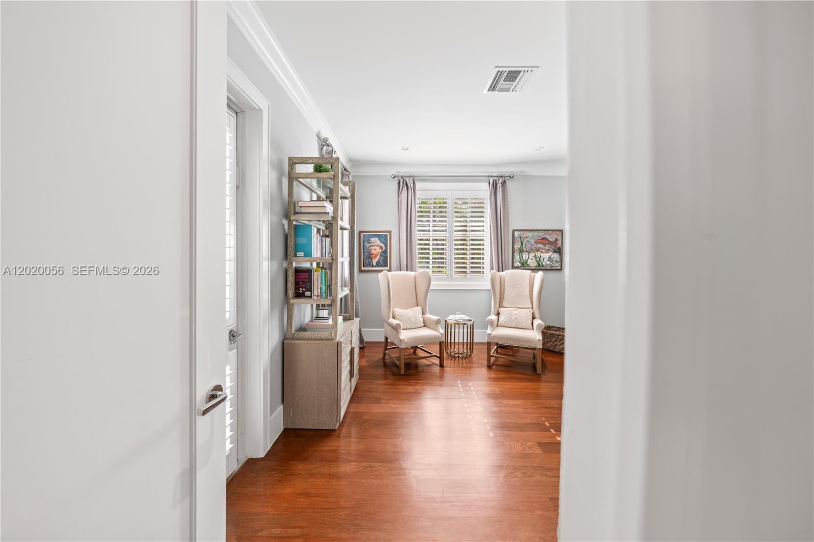 4196 Douglas Road Miami, FL 33133 - Photo 46 of 96 a living room with furniture and a table