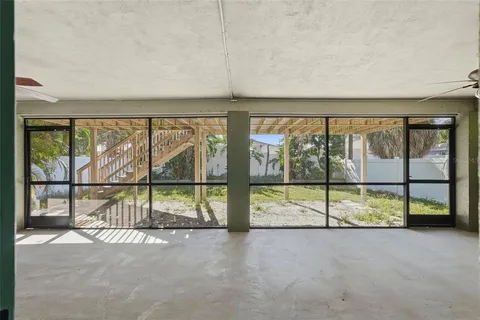 an empty room with sliding glass door
