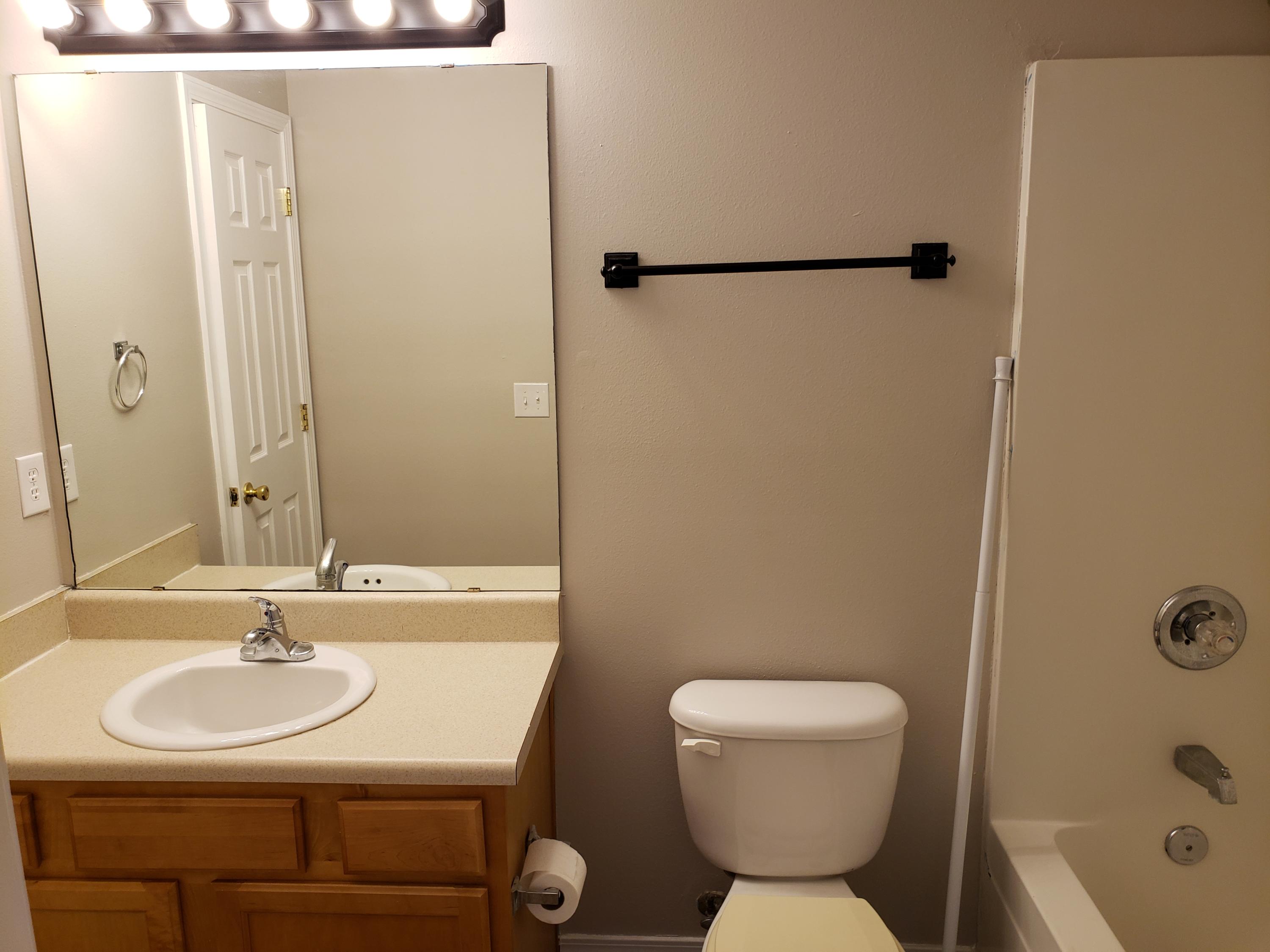 2127 Tom Street Navarre, FL 32566 - Photo 12 of 14 a bathroom with a sink toilet and shower
