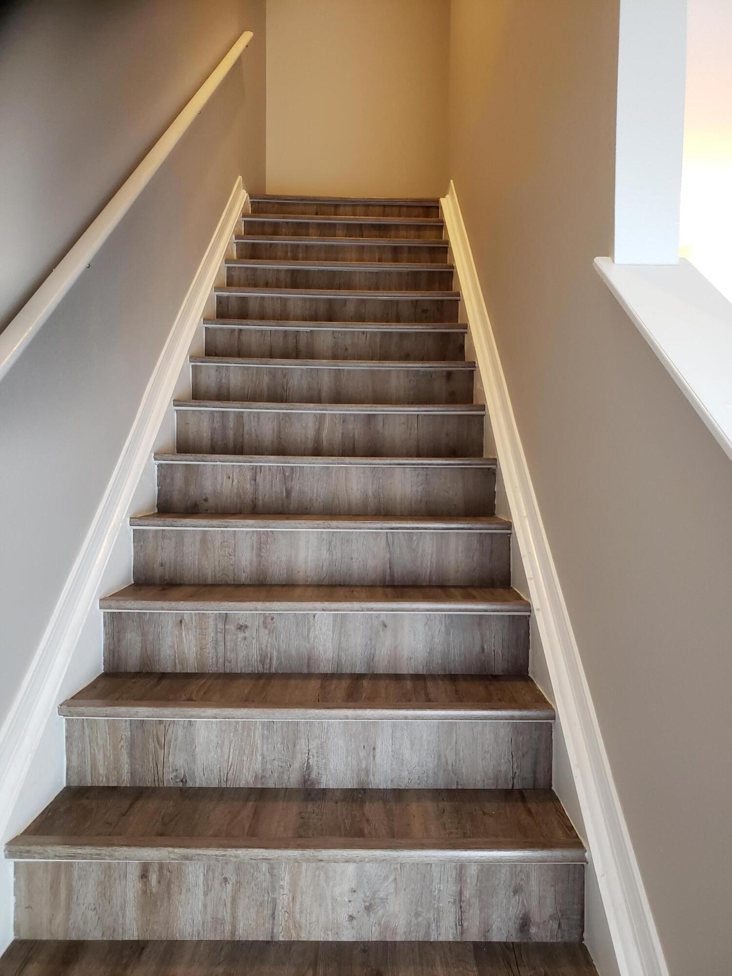 2127 Tom Street Navarre, FL 32566 - Photo 9 of 14 a view of staircase with white walls