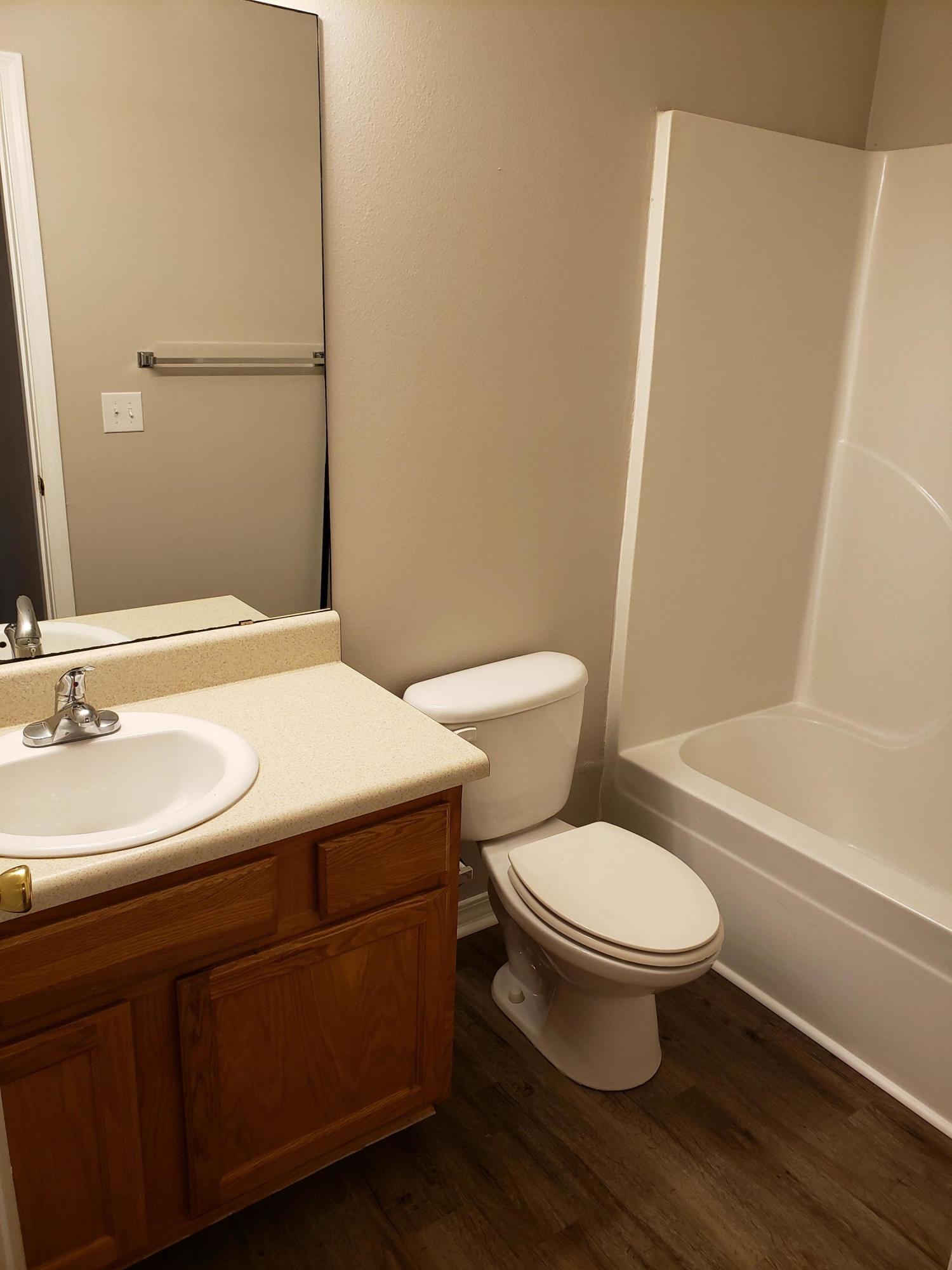 2127 Tom Street Navarre, FL 32566 - Photo 10 of 14 a bathroom with a sink toilet and shower