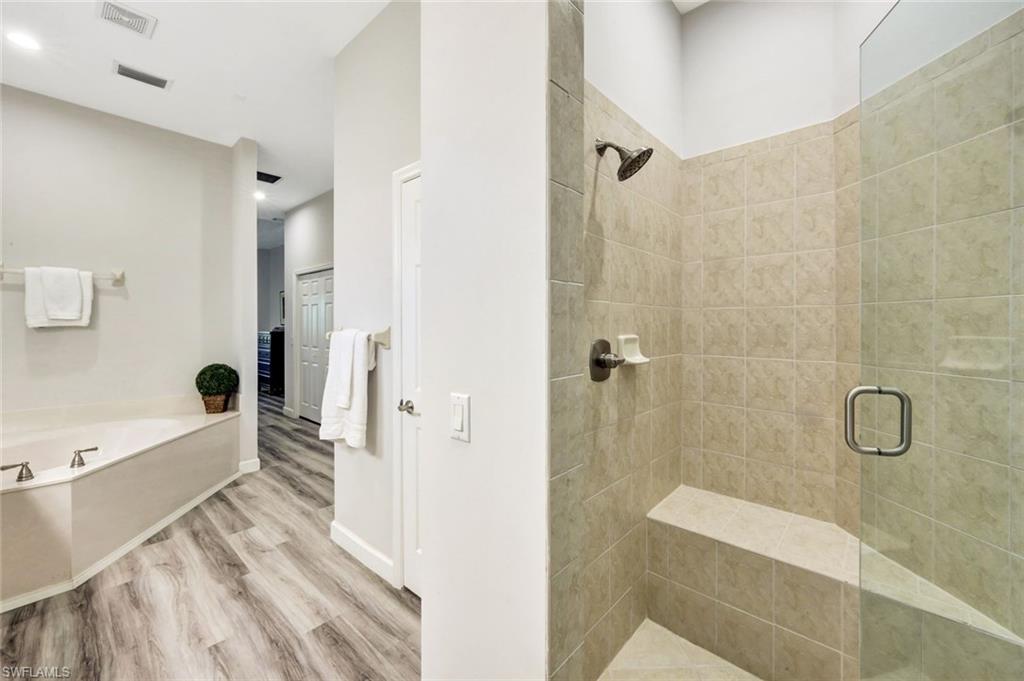3376 Sandpiper Way Naples, FL 34109 - Photo 24 of 50 Updated Shower with the New Frameless Door