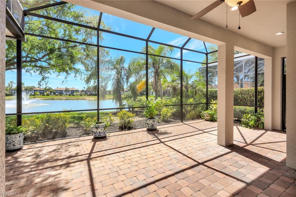 3376 Sandpiper Way Naples, FL 34109 - Photo 5 of 50 Oversized Lanai with Spectacular Lake and Fountain Views
