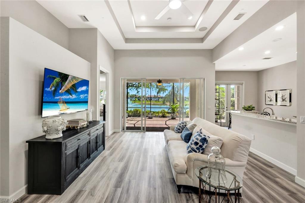 3376 Sandpiper Way Naples, FL 34109 - Photo 7 of 50 Living Room with Dramatic 14-Foot Tray Ceiling