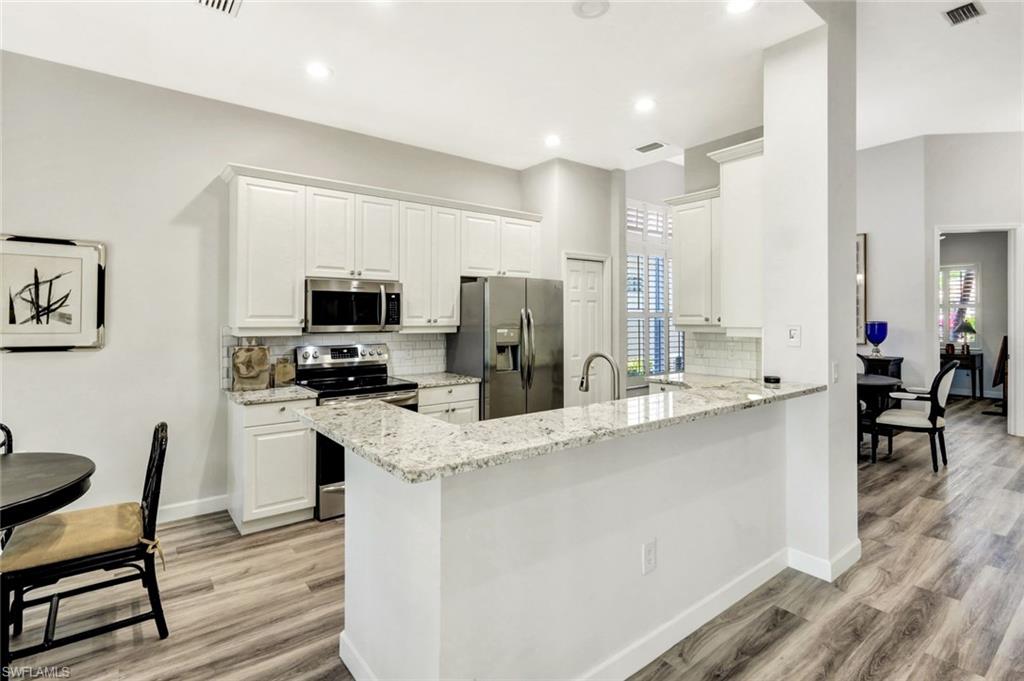 3376 Sandpiper Way Naples, FL 34109 - Photo 9 of 50 Modern Quartz Kitchen with New Appliances