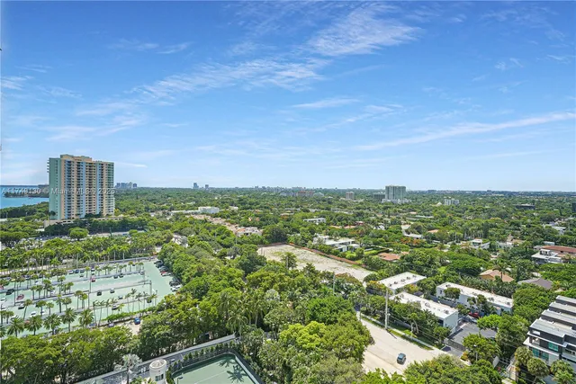 a view of a room with lots of wooden furniture