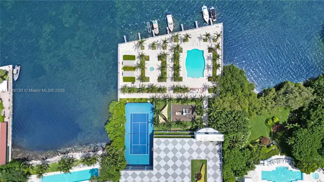 a view of a sitting area and swimming pool with a lake view