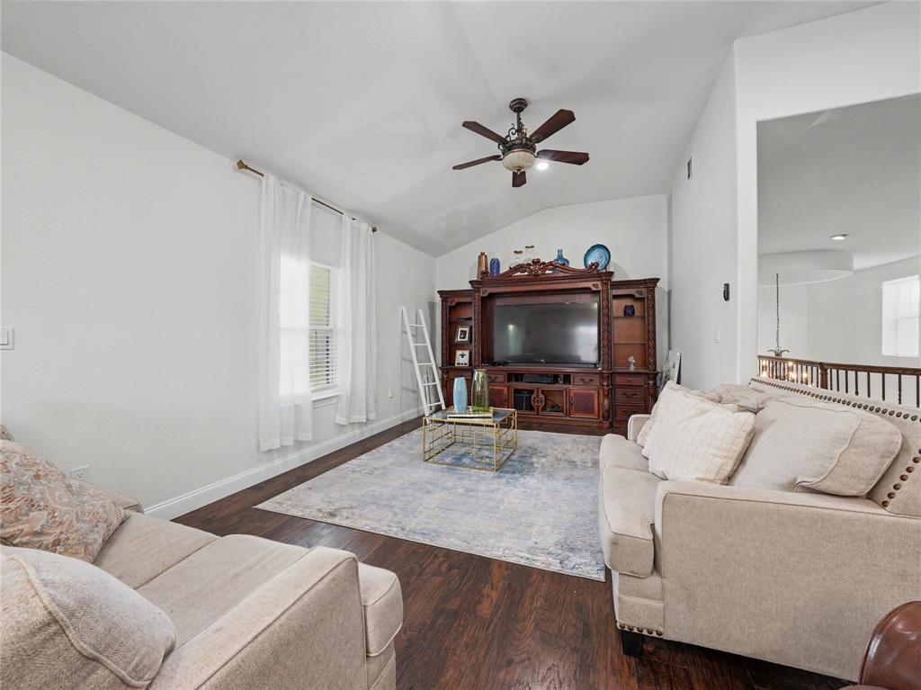6701 Nauert Road Forest Hill, TX 76140 - Photo 29 of 40 Living area with wood-finish flooring, vaulted ceiling, and a ceiling fan