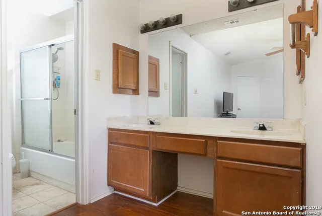 a bathroom with a sink and a mirror