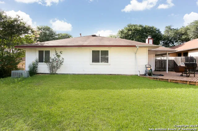 a view of a backyard with a garden and plants