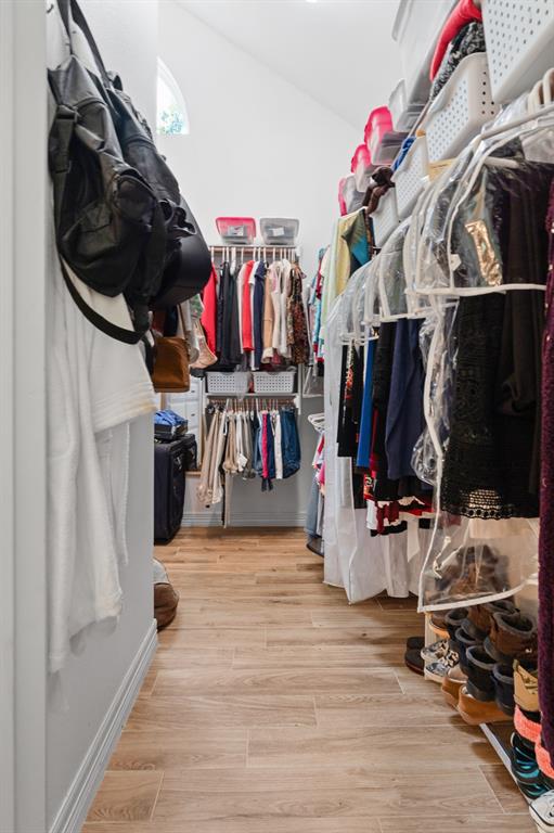 1264 Overlook Drive Whitney, TX 76692 - Photo 22 of 39 a view of walk in closet with clothes and shoes