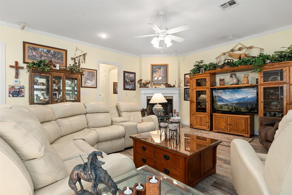 1264 Overlook Drive Whitney, TX 76692 - Photo 25 of 39 a living room with furniture and a flat screen tv