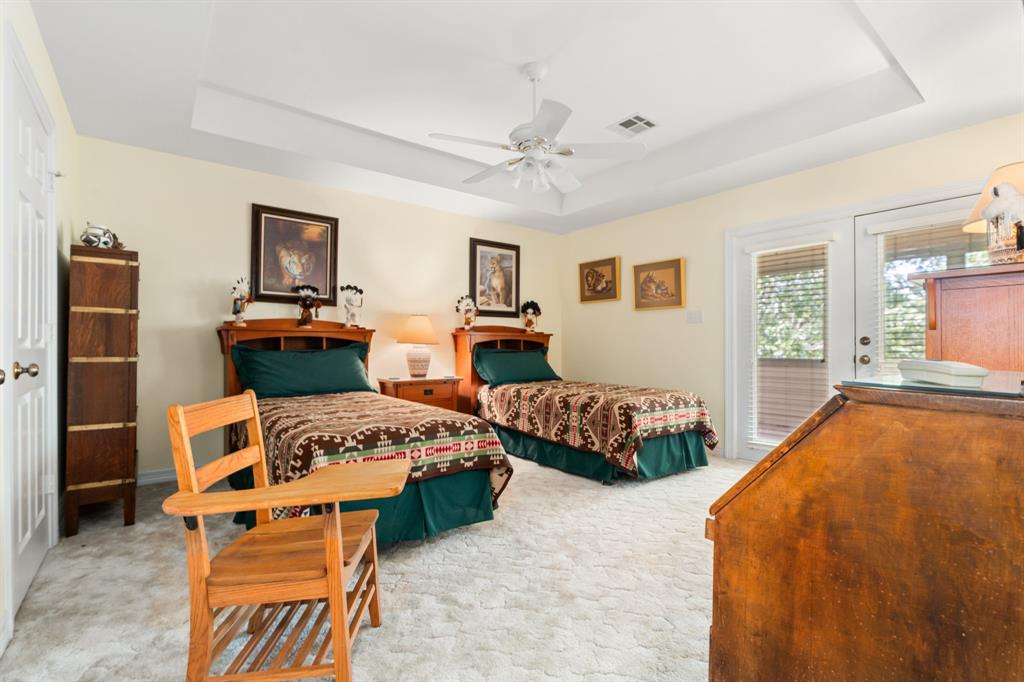 1264 Overlook Drive Whitney, TX 76692 - Photo 36 of 39 a bedroom with furniture and a wooden floor