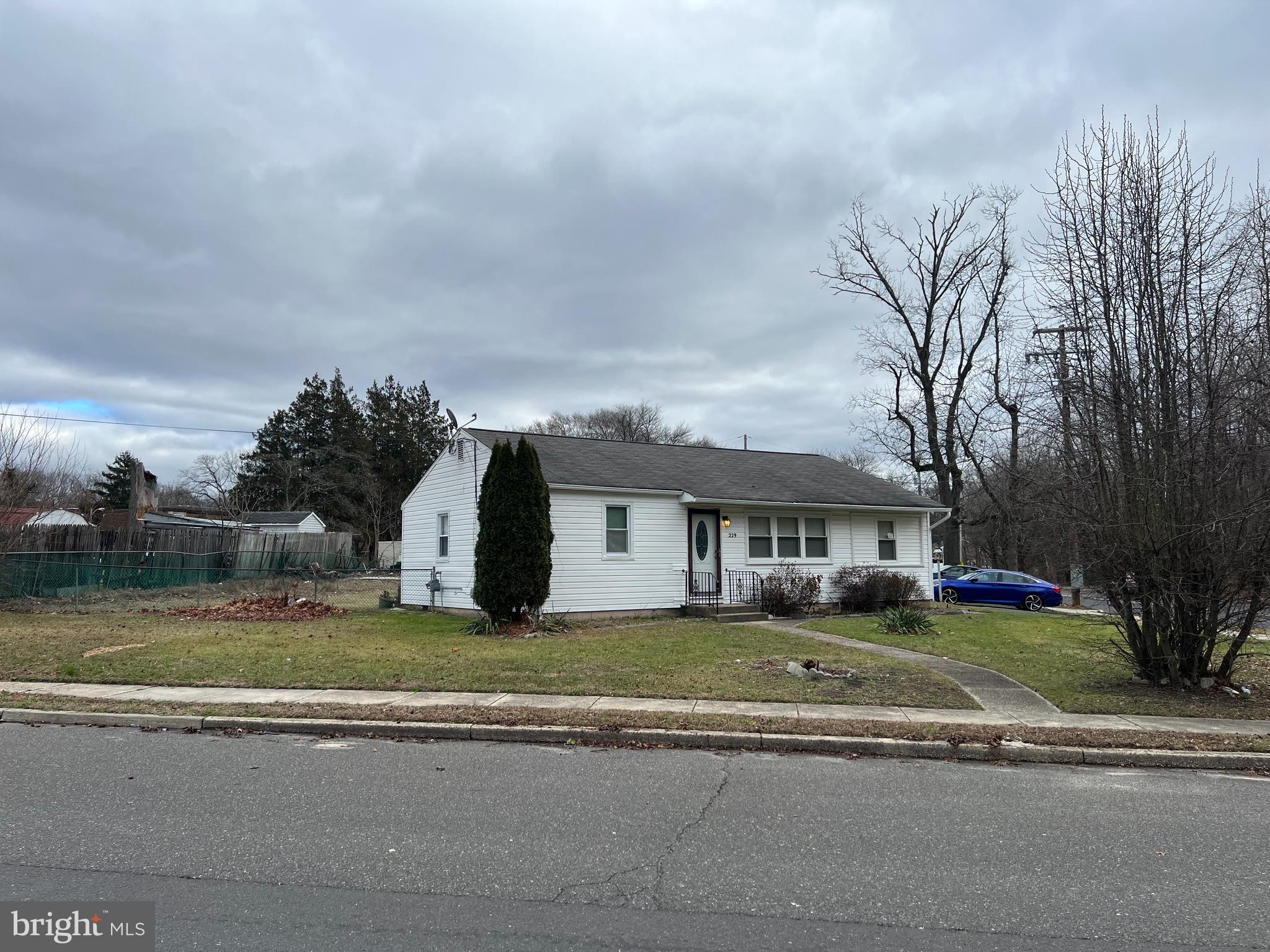 229 Chews Landing Road Lindenwold, NJ 08021 - Photo 2 of 11 a view of a house with a big yard and large trees