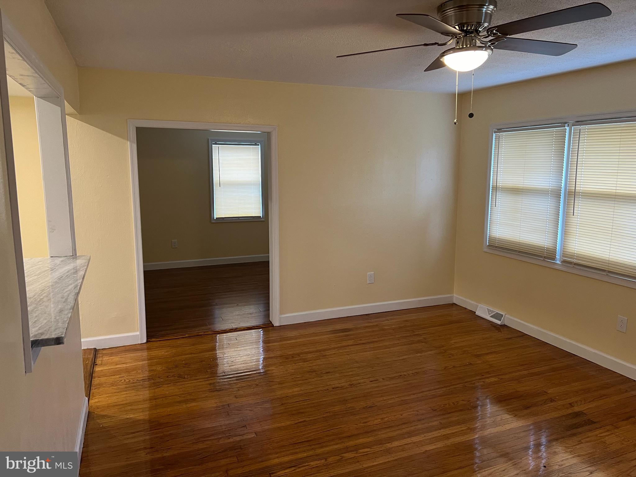 229 Chews Landing Road Lindenwold, NJ 08021 - Photo 6 of 11 wooden floor in an empty room with a window