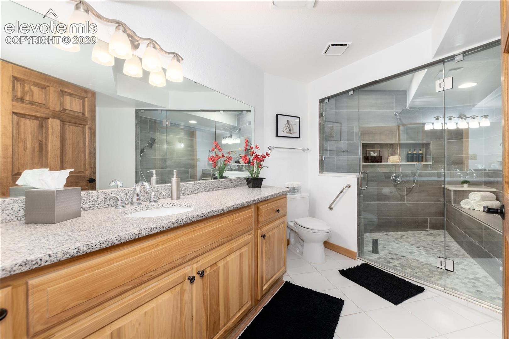 12730 Bridle Bit Road Colorado Springs, CO 80908 - Photo 22 of 48 Lower lever updated bathroom with full walk in shower