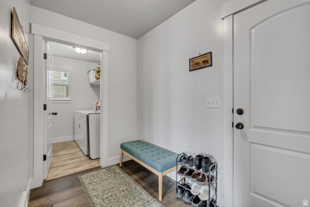 1577 Quailhill Road Saratoga Springs, UT 84045 - Photo 15 of 46 Mudroom with dark wood-style floors and washing machine and dryer